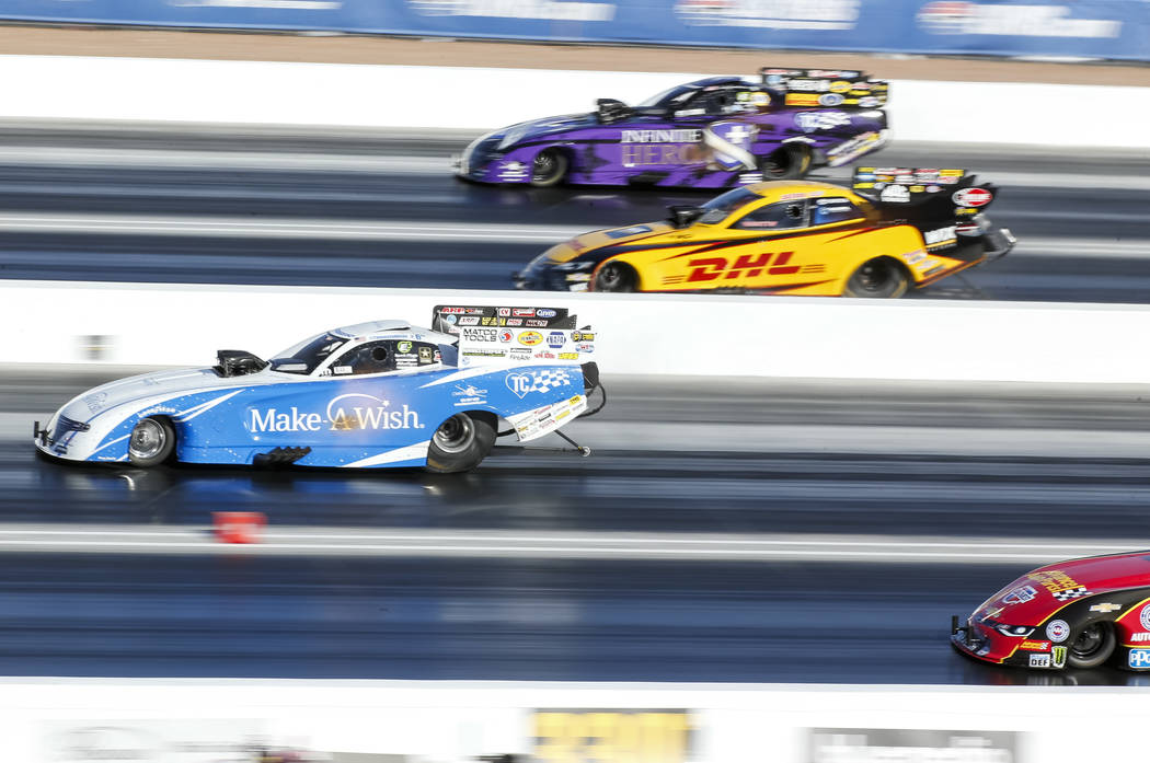 Funny Car drivers, from top to bottom, J.R. Todd, Tommy Johnson Jr., Jack Beckman, and Courtney Force compete in the final elimination race of the DENSO Spark Plug NHRA Four-Wide Nationals at The ...