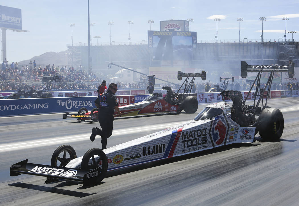Top Fuel driver Antron Brown prepares to compete during the second day of qualifying for the DENSO Spark Plugs NHRA Nationals at The Strip at Las Vegas Motor Speedway in Las Vegas on Saturday, Apr ...