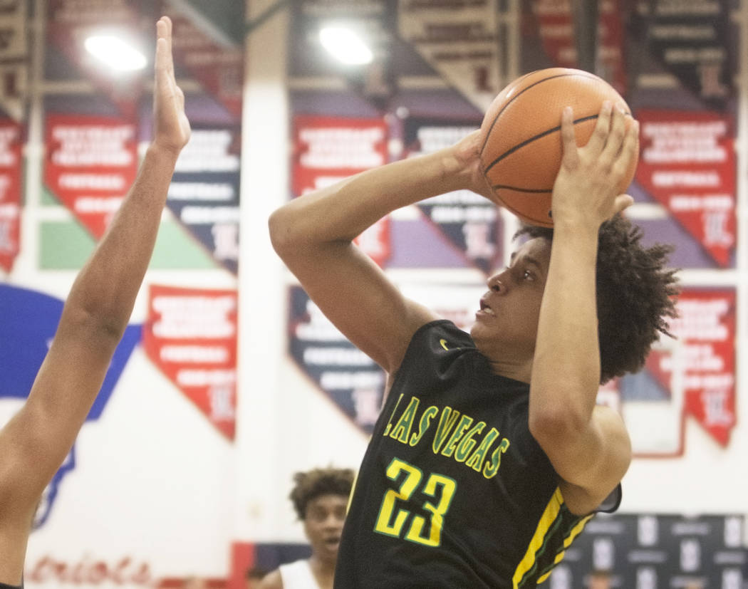 Las Vegas Prospects forward Jalen Hill (23) shoots over Seattle Rotary's Jaden McDaniels (2) in the first half during the Made Hoops Summer Showcase on Wednesday, July 25, 2018, at Liberty High Sc ...