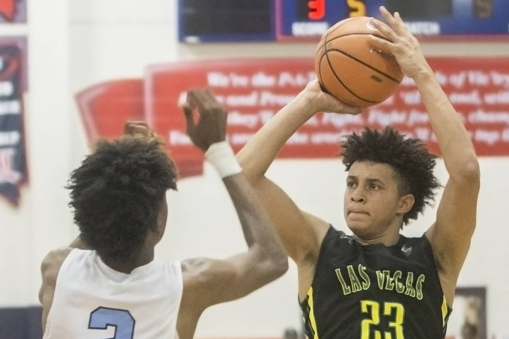 Las Vegas Prospects forward Jalen Hill (23) shoots over Seattle Rotary's Jaden McDaniels (2) in the first half during the Made Hoops Summer Showcase on Wednesday, July 25, 2018, at Liberty High Sc ...