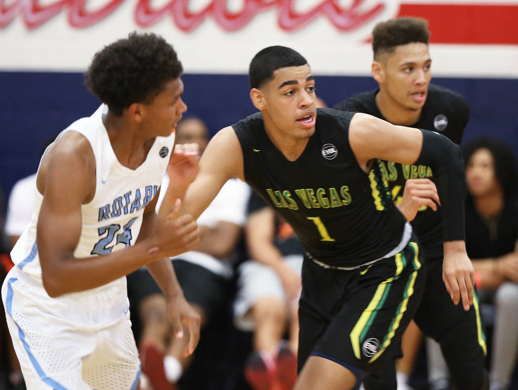 Las Vegas Prospects guard Julian Strawther (1) sprints up court past Seattle Rotary guard RaeQuan Battle (24) in the first half during the Made Hoops Summer Showcase on Wednesday, July 25, 2018, a ...