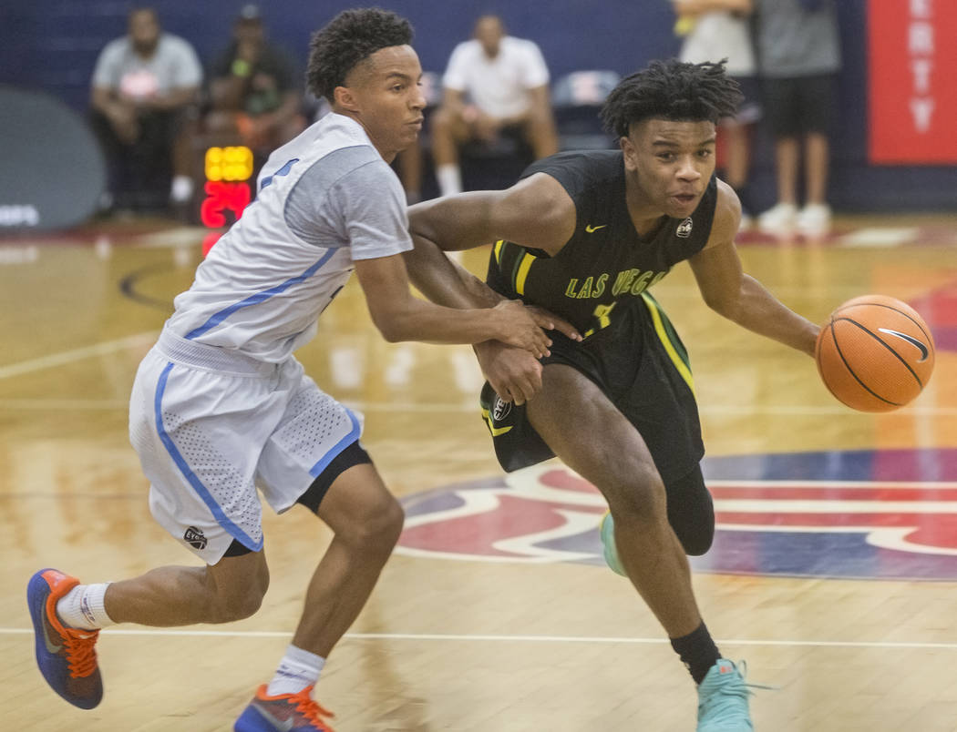 Las Vegas Prospects point guard Jaden Hardy (3) drives past Seattle Rotary guard Kenneth Curtis (1) in the first half during the Made Hoops Summer Showcase on Wednesday, July 25, 2018, at Liberty ...