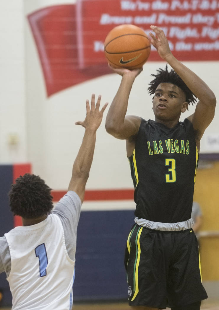 Las Vegas Prospects point guard Jaden Hardy (3) shoots over Seattle Rotary guard Kenneth Curtis (1) in the first half during the Made Hoops Summer Showcase on Wednesday, July 25, 2018, at Liberty ...