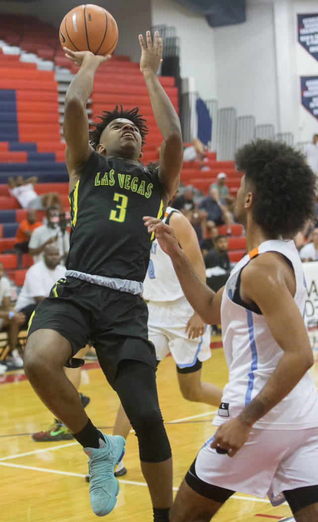 Las Vegas Prospects point guard Jaden Hardy (3) drives past Seattle Rotary forward Jaden McDaniels (2) in the first half during the Made Hoops Summer Showcase on Wednesday, July 25, 2018, at Liber ...