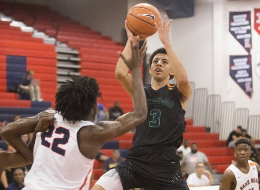 Oakland Soldiers point guard Scotty Pippen (3) shoots over Bradley Beal Elite forward Terrrence Hargrove Jr (22) in the first half during the Made Hoops Summer Showcase on Wednesday, July 25, 201 ...