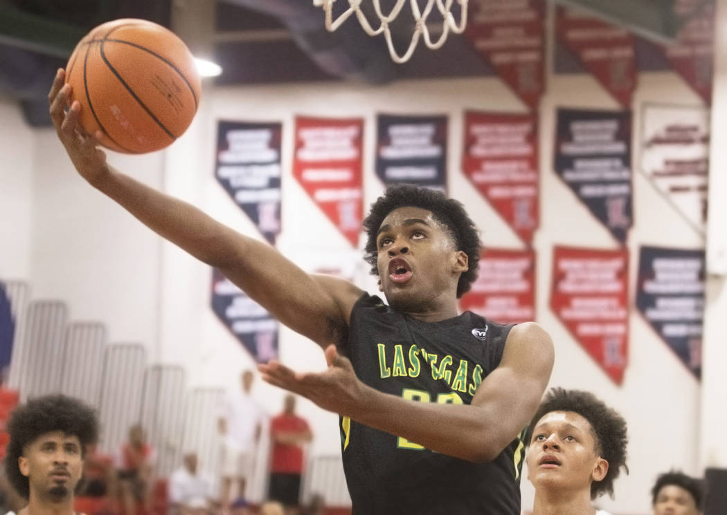 Las Vegas Prospects guard Joshua Christopher (32) drives past Seattle Rotary guard Kenneth Curtis (1) in the first half during the Made Hoops Summer Showcase on Wednesday, July 25, 2018, at Libert ...