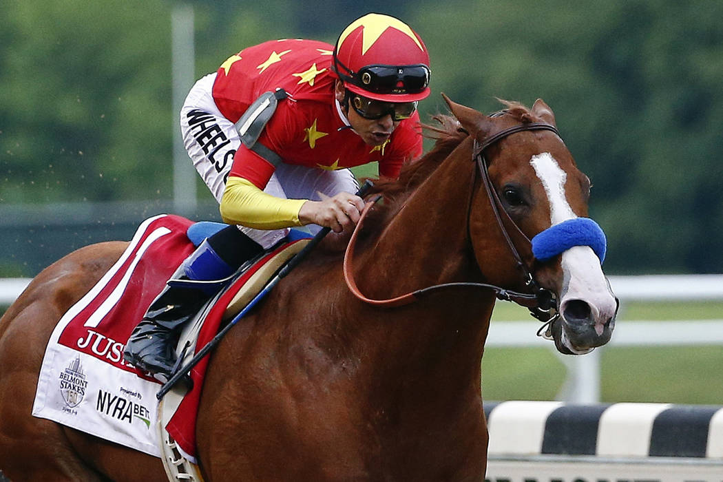 In this June 9, 2018, file photo, Justify (1), with jockey Mike Smith up, crosses the finish line to win the 150th running of the Belmont Stakes horse race and the Triple Crown in Elmont, N.Y. (AP ...
