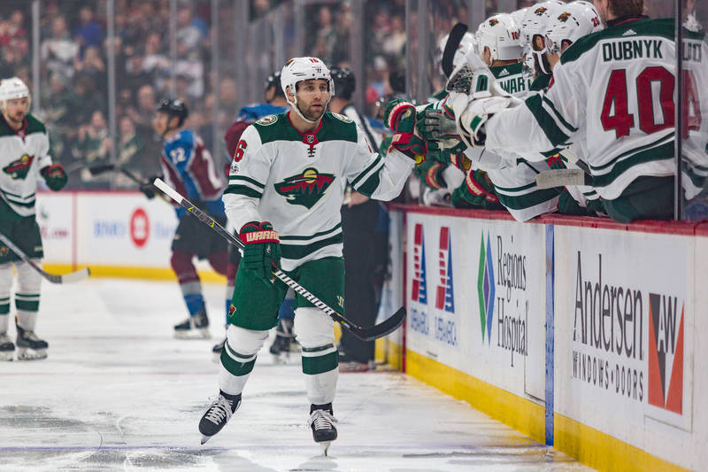 Nov 24, 2017; Saint Paul, MN, USA; Minnesota Wild Left Wing Jason Zucker (16) celebrates with teammates after his first period goal against the Colorado Avalanche at Xcel Energy Center. (Harrison ...