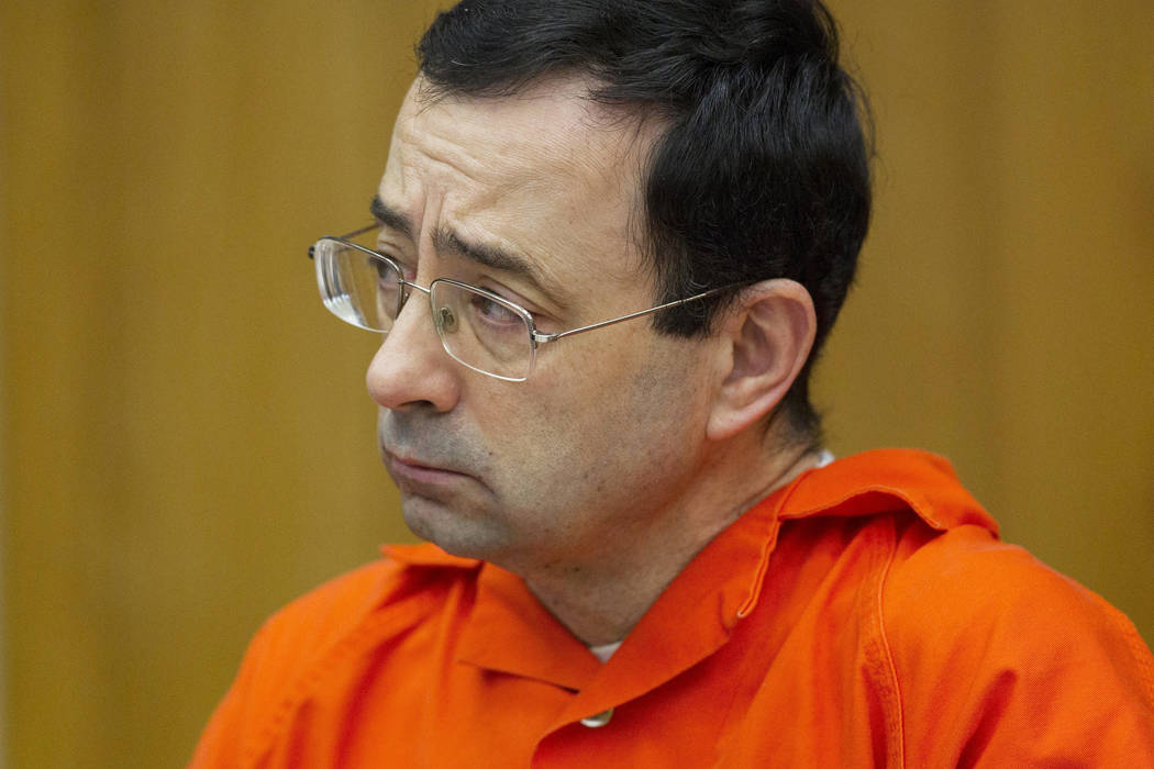 FILE - In this Jan. 31, 2018, file photo, Larry Nassar appears for his sentencing at Eaton County Circuit Court in Charlotte, Mich. A letter signed by at least 120 victims sexual abuse by former ...