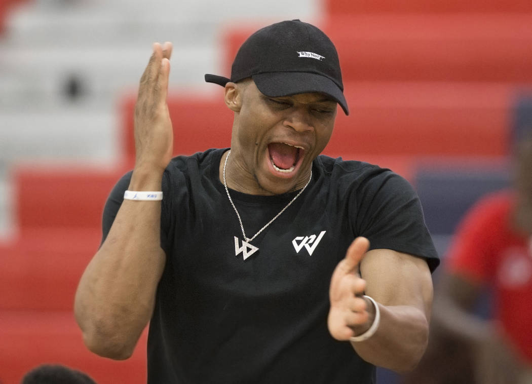 Oklahoma City Thunder point guard Russell Westbrook cheers for Team Why Not during the Made Hoops Summer Showcase on Wednesday, July 25, 2018, at Liberty High School, in Las Vegas. Benjamin Hager ...