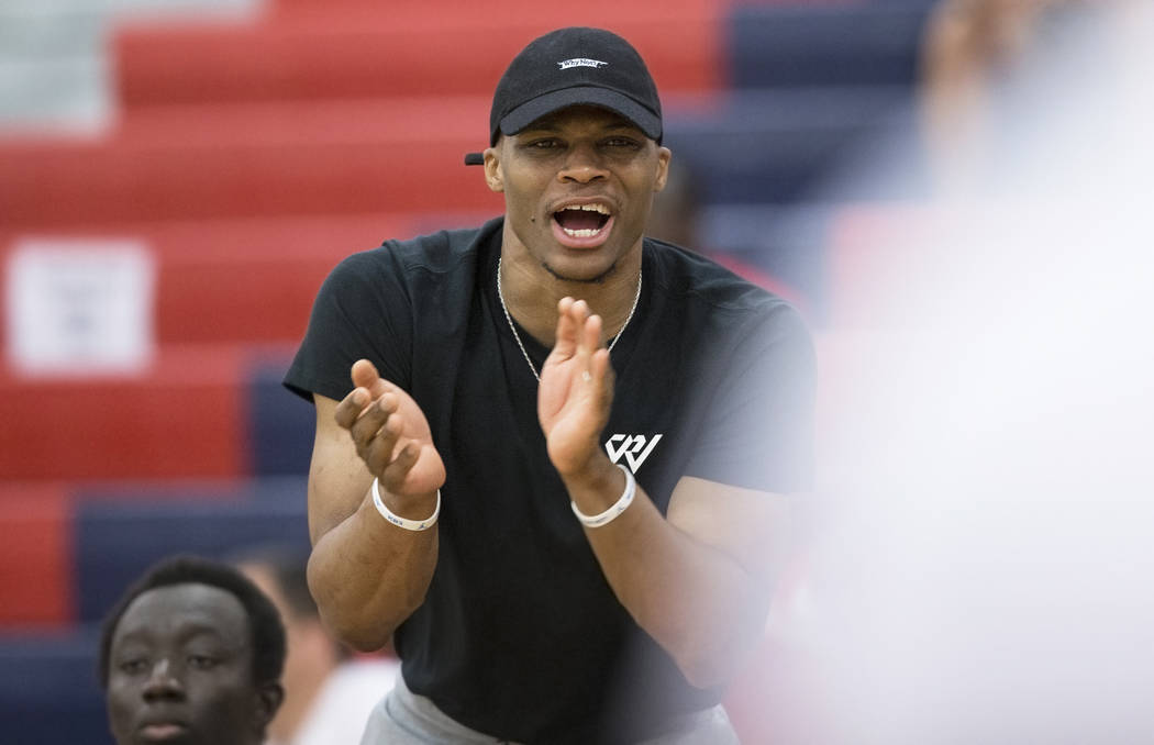 Oklahoma City Thunder point guard Russell Westbrook cheers for Team Why Not during the Made Hoops Summer Showcase on Wednesday, July 25, 2018, at Liberty High School, in Las Vegas. Benjamin Hager ...