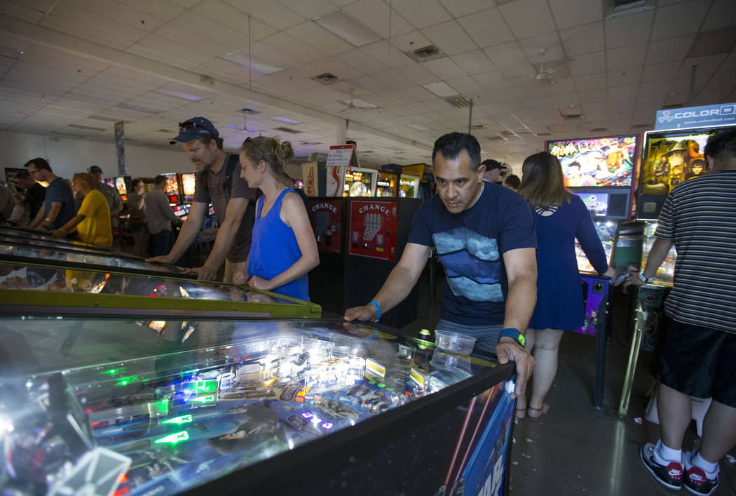Joel Pastrana of Los Angeles, Calif., plays on a Star Wars pinball machine during a visit to the Pinball Hall of Fame located at 1610 E. Tropicana Avenue in Las Vegas on Saturday, July 28, 2018. R ...