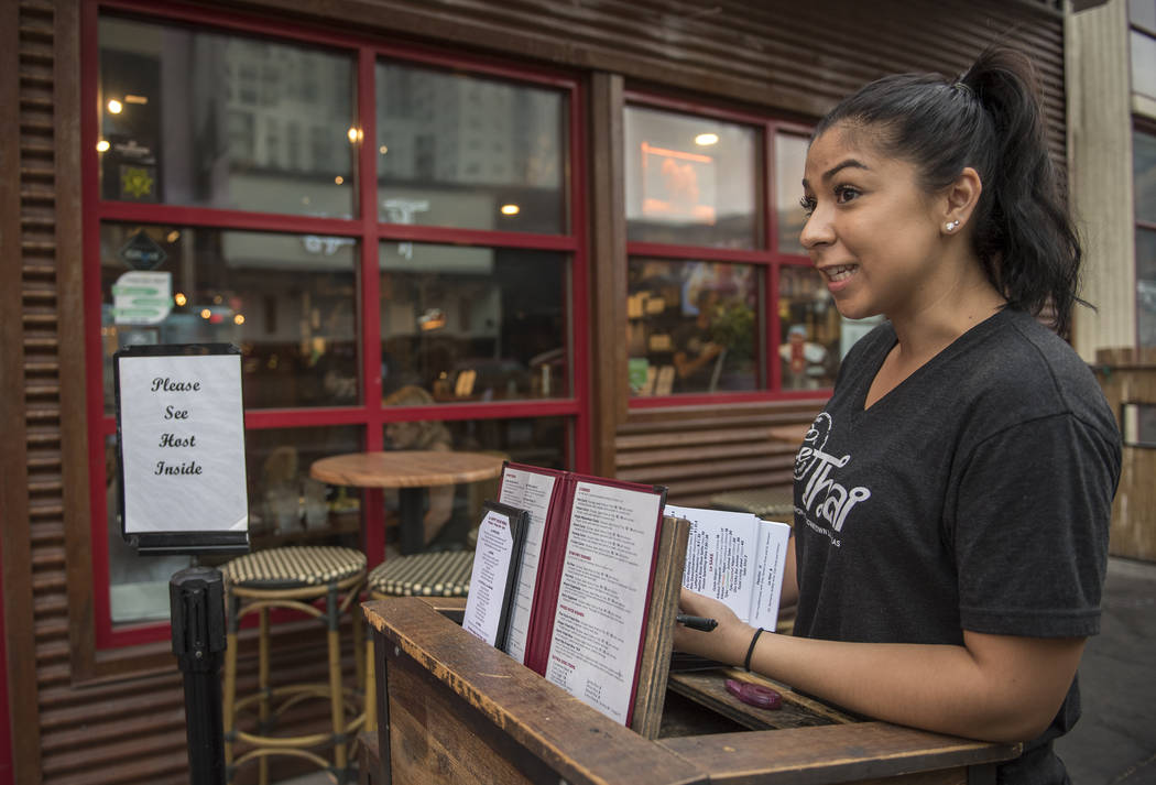 Renee Mashore, an employee at Le Thai restaurant, talks about the weather at the Fremont Street Experience in Las Vegas on Thursday, June 30, 2016. (Martin S. Fuentes/Las Vegas Review-Journal)