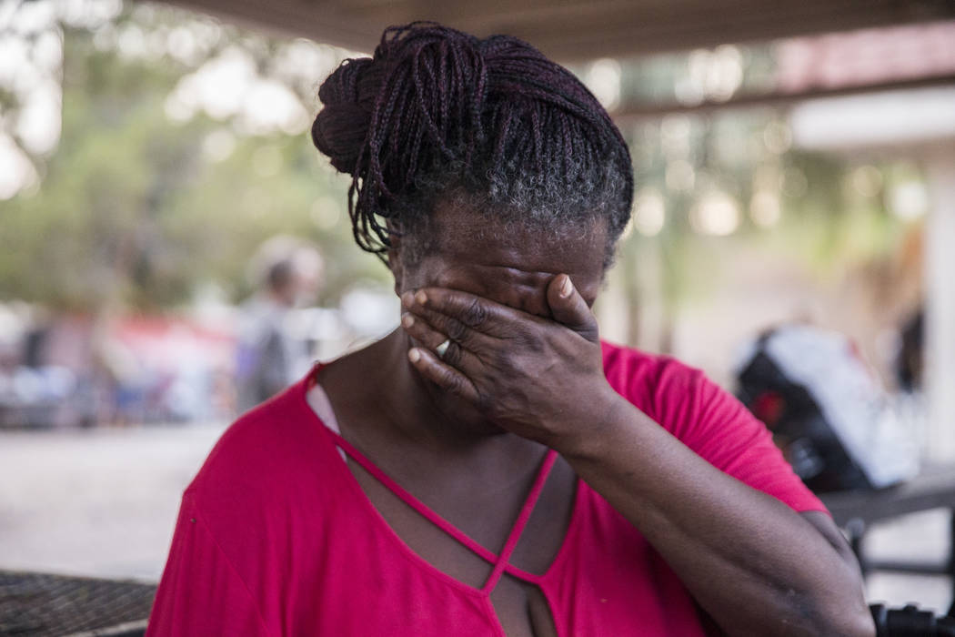 Rosslyn Hubbard wipes tears from her eyes as she talks about the circumstances that caused her homelessness on Thursday, July 27, 2018, at the city of Las Vegas' homeless courtyard. The courtyard ...