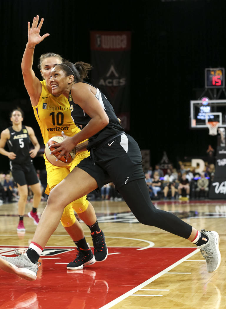 Las Vegas Aces center A'ja Wilson (22) drives to the net against Los Angeles Sparks center Maria Vadeeva (10) during the second half of a WNBA basketball game at the Mandalay Bay Events Center in ...