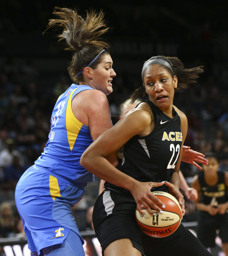 Las Vegas Aces center A'ja Wilson (22) drives against Chicago Sky center Stefanie Dolson (31) during the second half of a WNBA basketball game at Mandalay Bay Events Center in Las Vegas on Thursda ...