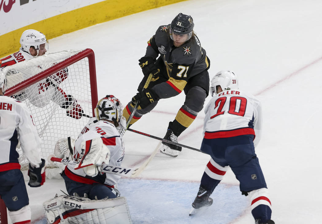 Vegas Golden Knights center William Karlsson (71) gets the puck past Washington Capitals goaltender Braden Holtby (70) for a goal during the first period in Game 1 of the NHL hockey Stanley Cup Fi ...