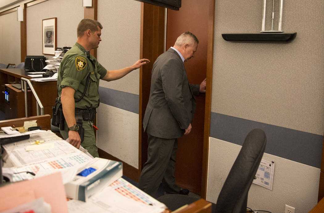 Jarom Boyes, right, an Air Force sergeant, charged in the shooting death of his wife, exits the courtroom after he was found guilty of involuntary manslaughter at the Regional Justice Center in do ...