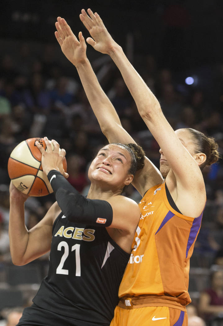 Aces guard Kayla McBride (21) drives past Phoenix Mercury guard Diana Taurasi (3) in the second quarter on Wednesday, August, 1, 2018, at the Mandalay Bay Events Center, in Las Vegas. Benjamin Hag ...