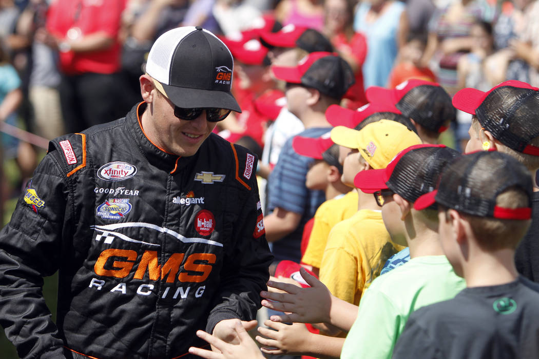Spencer Gallagher is seen during drivers introductions for the NASCAR Xfinity Series auto race, Saturday, Aug. 12, 2017, at Mid Ohio Sports Car Course in Lexington, OH. (AP Photo/Tom E. Puskar)