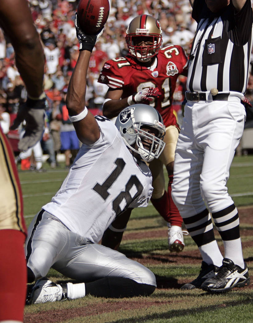Oakland Raiders wide receiver Randy Moss celebrates after scoring in the second quarter of an NFL football game against the San Francisco 49ers, Sunday, Oct. 8, 2006, in San Francisco. (AP Photo/P ...