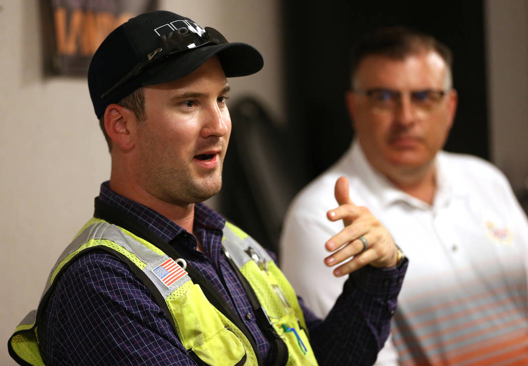 Kiewit's safety manager Robert Murphy, left, and public information officer Jay Proskovec, discuss heat safety for their workers in the Nevada Department of Transportation Project Neon at a Kiewit ...