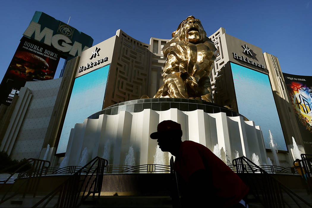 A man rides his bike past the MGM Grand hotel and casino in Las Vegas in 2015. (The Associated Press)