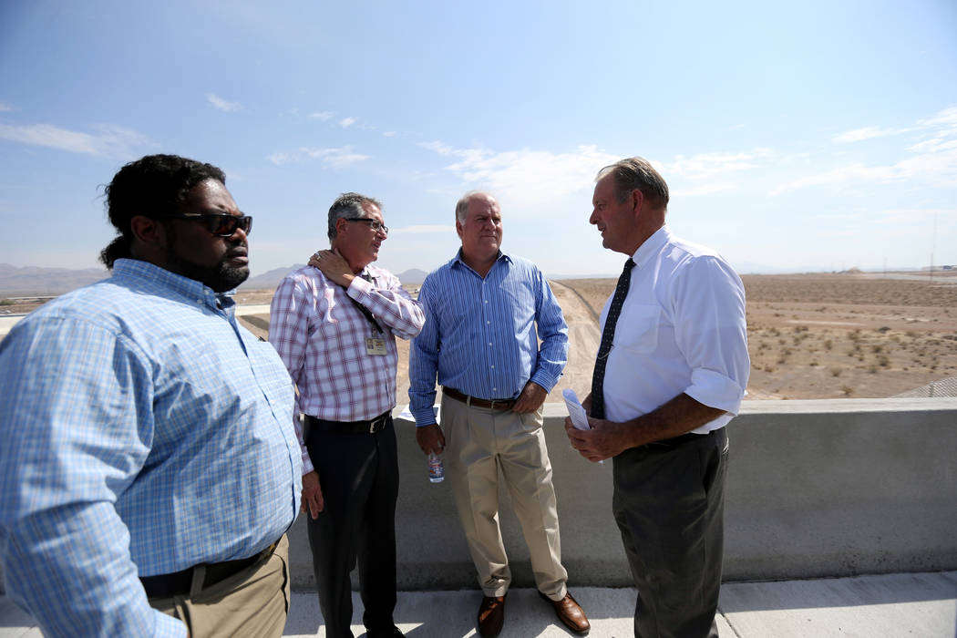 North Las Vegas Mayor John Lee, right, visits with, from left, Senior Engineer Tom Brady, Engineering and Construction Services Division Manager Dale Daffern and Chief Financial Officer Darren Ada ...