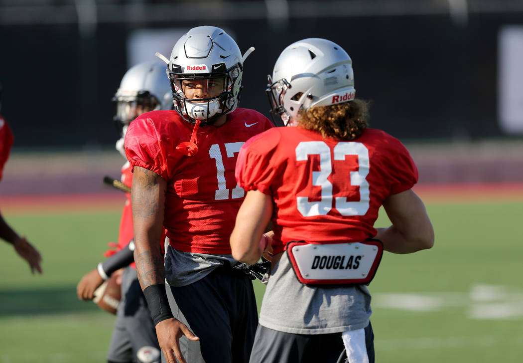 UNLV strong safety Evan Austrie (17) with teammate Dalton Baker (33) during practice at Rebel Park on the UNLV campus Monday, Aug. 6, 2018. K.M. Cannon Las Vegas Review-Journal @KMCannonPhoto