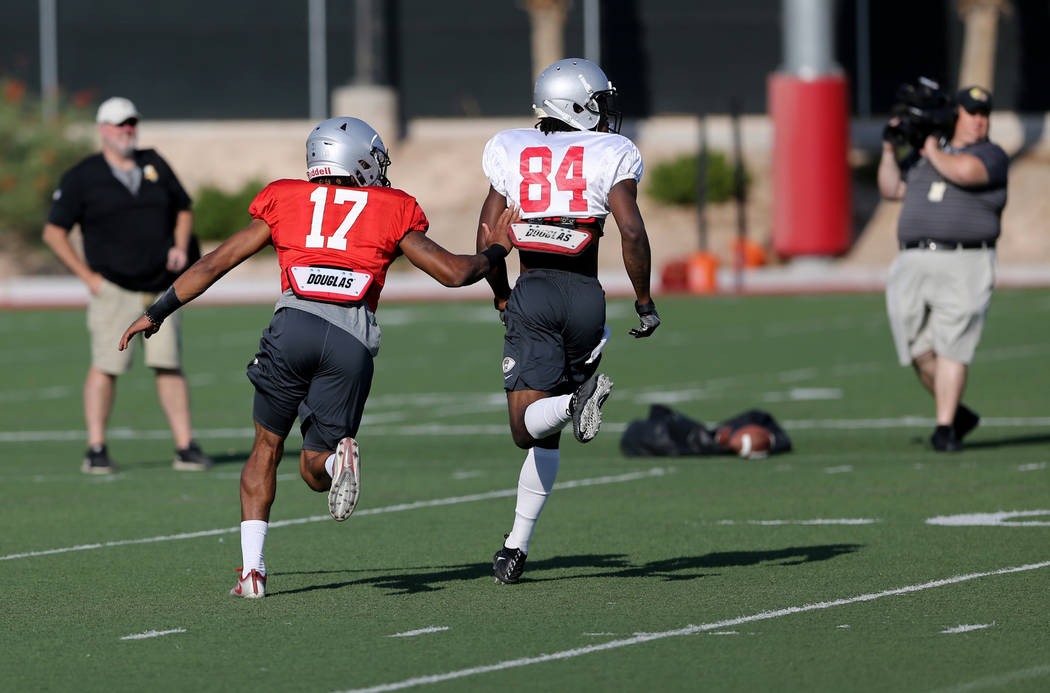 UNLV strong safety Evan Austrie (17) with teammate Kendal Keys (84) during practice at Rebel Park on the UNLV campus Monday, Aug. 6, 2018. K.M. Cannon Las Vegas Review-Journal @KMCannonPhoto