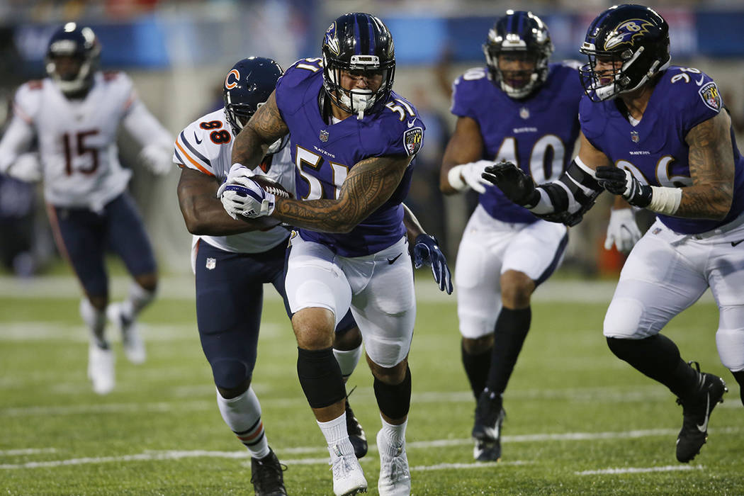 Baltimore Ravens linebacker Kamalei Correa (51) runs after an interception against the Chicago Bears during the first half at the Pro Football Hall of Fame NFL preseason game Thursday, Aug. 2, 201 ...