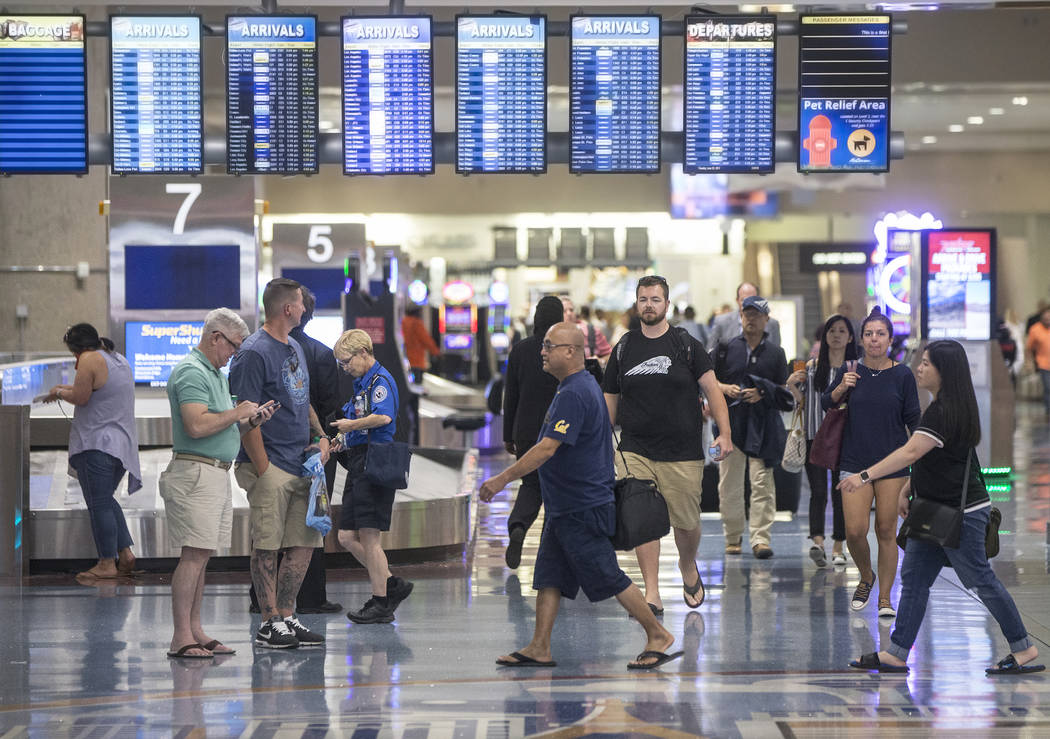 Passengers walk through Terminal 1 baggage claim at McCarran International Airport on Thursday, June 28, 2018, in Las Vegas. Benjamin Hager Las Vegas Review-Journal @benjaminhphoto
