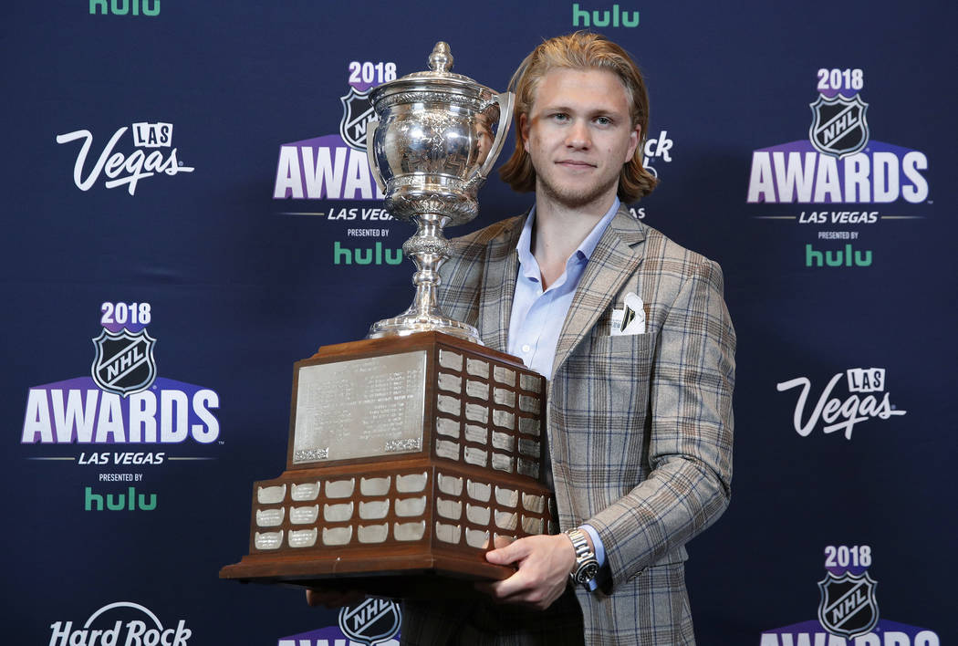 Vegas Golden Knights' William Karlsson poses with the Lady Byng Trophy after winning the honor at the NHL Awards, Wednesday, June 20, 2018, in Las Vegas. (AP Photo/John Locher)