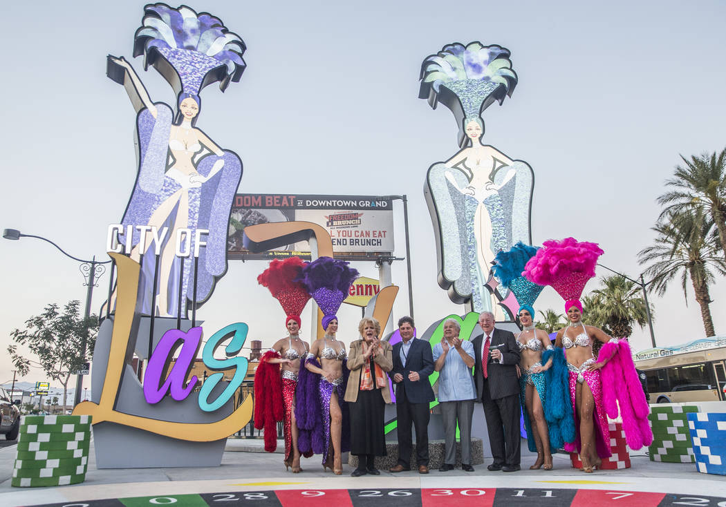 Las Vegas Mayor Carolyn Goodman, third from left, Chris Fiumara, vice president and general manager of the Stratosphere, Councilman Bob Coffin and former Las Vegas Mayor Oscar Goodman take photos ...