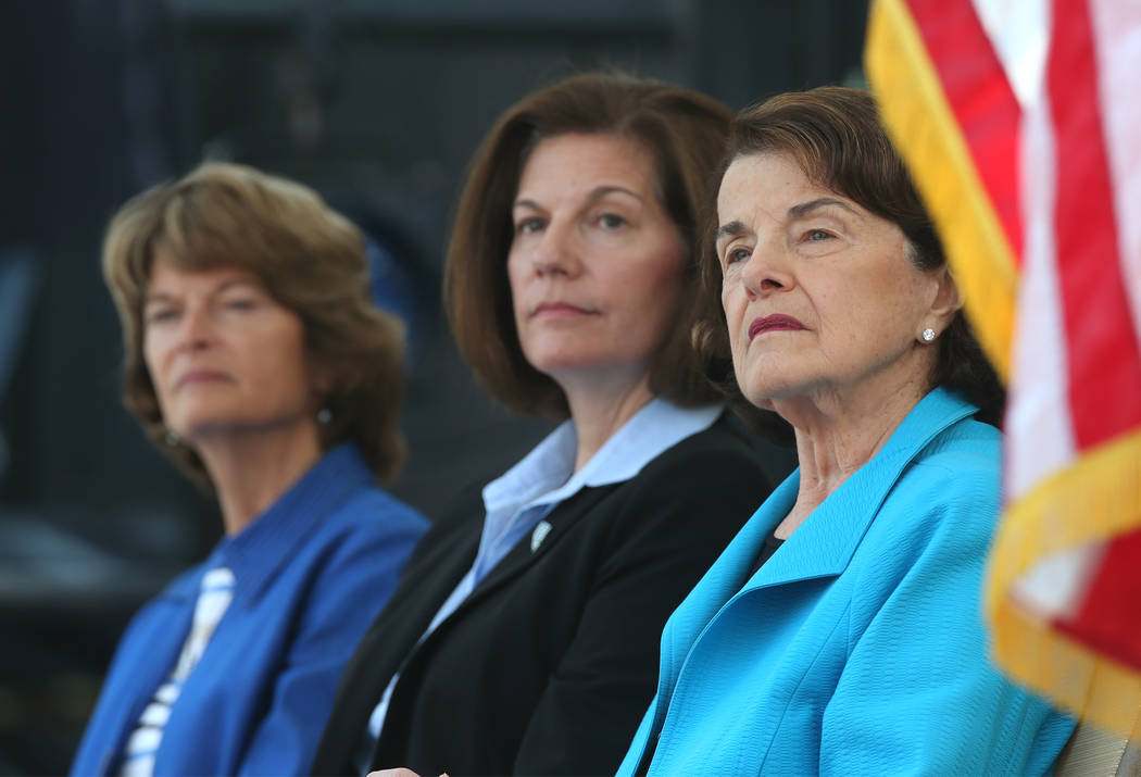 From left, U.S. Sens. Lisa Murkowski, R-Alaska, Catherine Cortez Masto, D-Nev., and Dianne Feinstein, D-Calif., listen to speakers at the 22nd annual Lake Tahoe Summit, at Sand Harbor State Park, ...