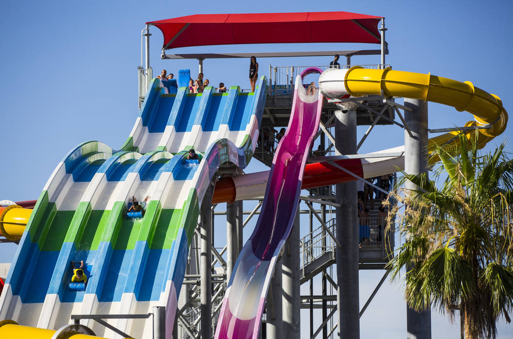 Hotel guests enjoy a large slide at the pool area at Circus Circus in Las Vegas on Friday, June 22, 2018. Chase Stevens Las Vegas Review-Journal @csstevensphoto