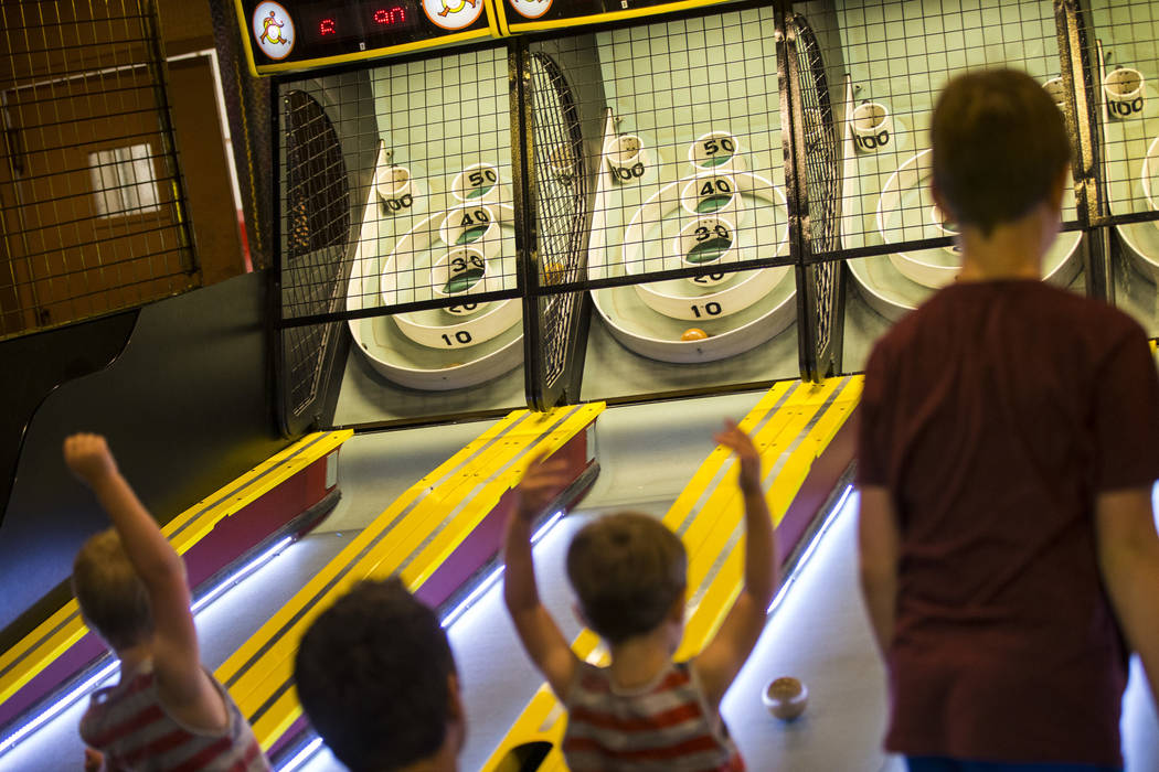 People play skeeball at the carnival midway at Circus Circus in Las