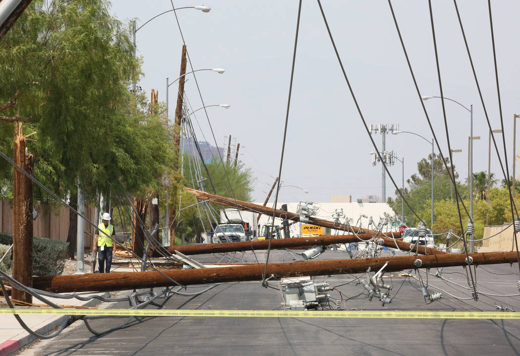 Downed power lines at Sunset Road and Polaris Avenue on Friday, Aug. 10, 2018, in Las Vegas. Forklift knocks down 13 power poles. Bizuayehu Tesfaye/Las Vegas Review-Journal @bizutesfaye