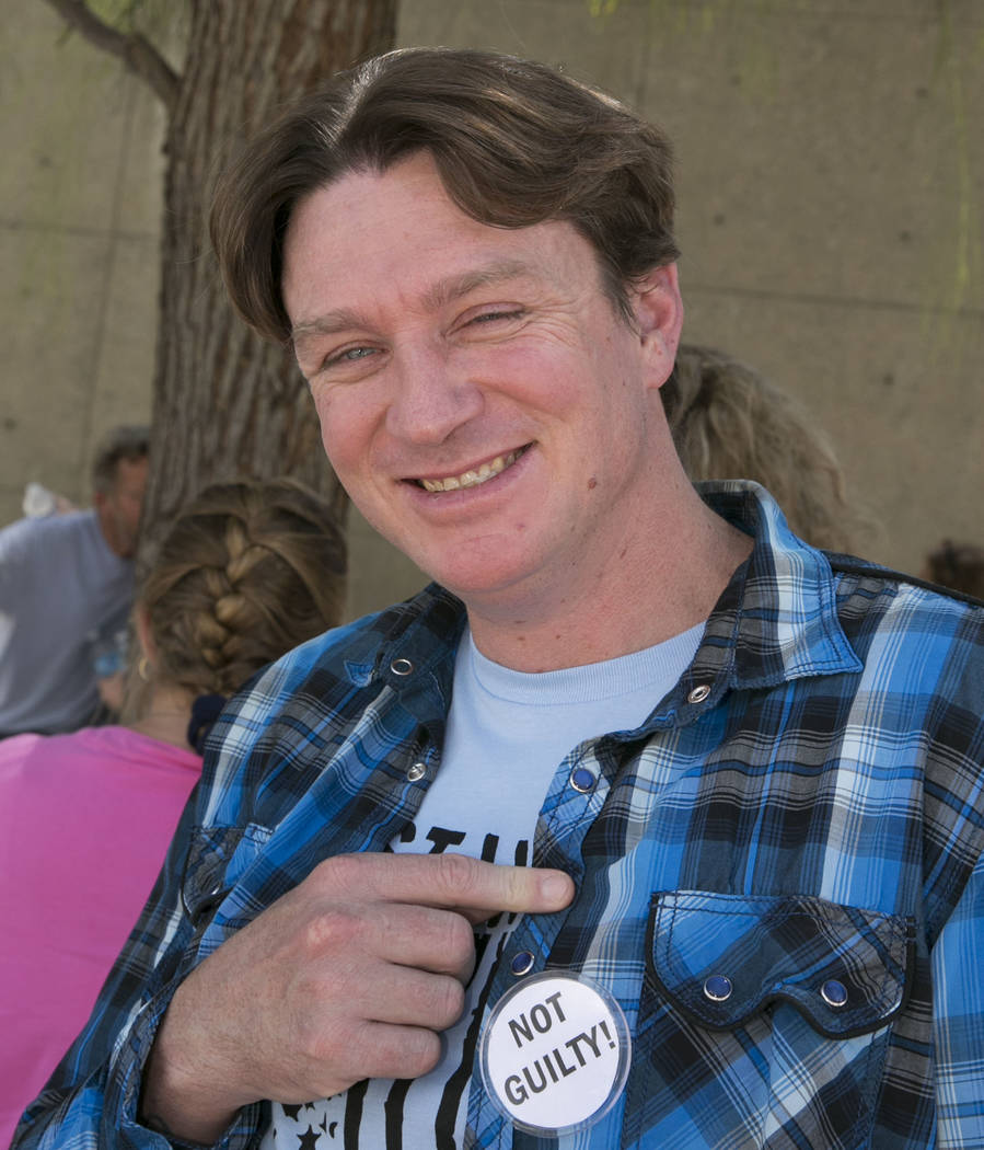 Steven Stewart shows off his 'Not Guilty' pin outside the Lloyd George U.S. Courthouse on Wednesday, Aug. 23, 2017, in Las Vegas. Stewart and three other defendants in the Bunkerville standoff cas ...