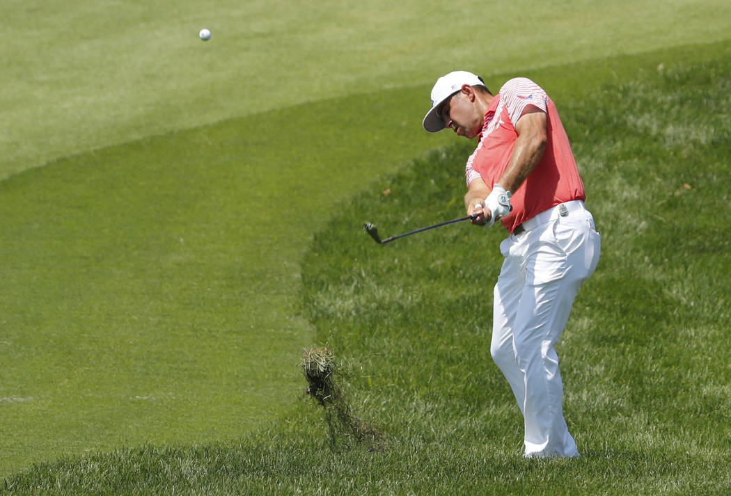 Gary Woodland hits to the eighth green during the second round of the PGA Championship golf tournament at Bellerive Country Club, Friday, Aug. 10, 2018, in St. Louis. (AP Photo/Jeff Roberson)