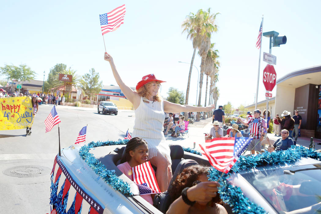 Clark County Clerk Lynn Marie Goya waves a flag during the 69th Annual Boulder City Damboree parade in Boulder City, Tuesday, July, 4, 2017. Elizabeth Brumley Las Vegas Review-Journal