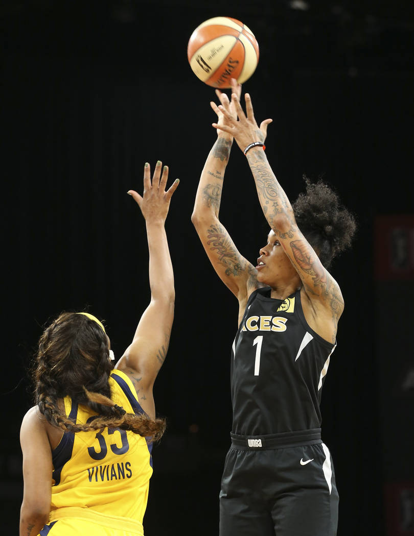 Las Vegas Aces forward Tamera Young (1) takes a shot over Indiana Fever guard Victoria Vivians (35) during the first half of a WNBA basketball game at the Mandalay Bay Events Center on Saturday, A ...