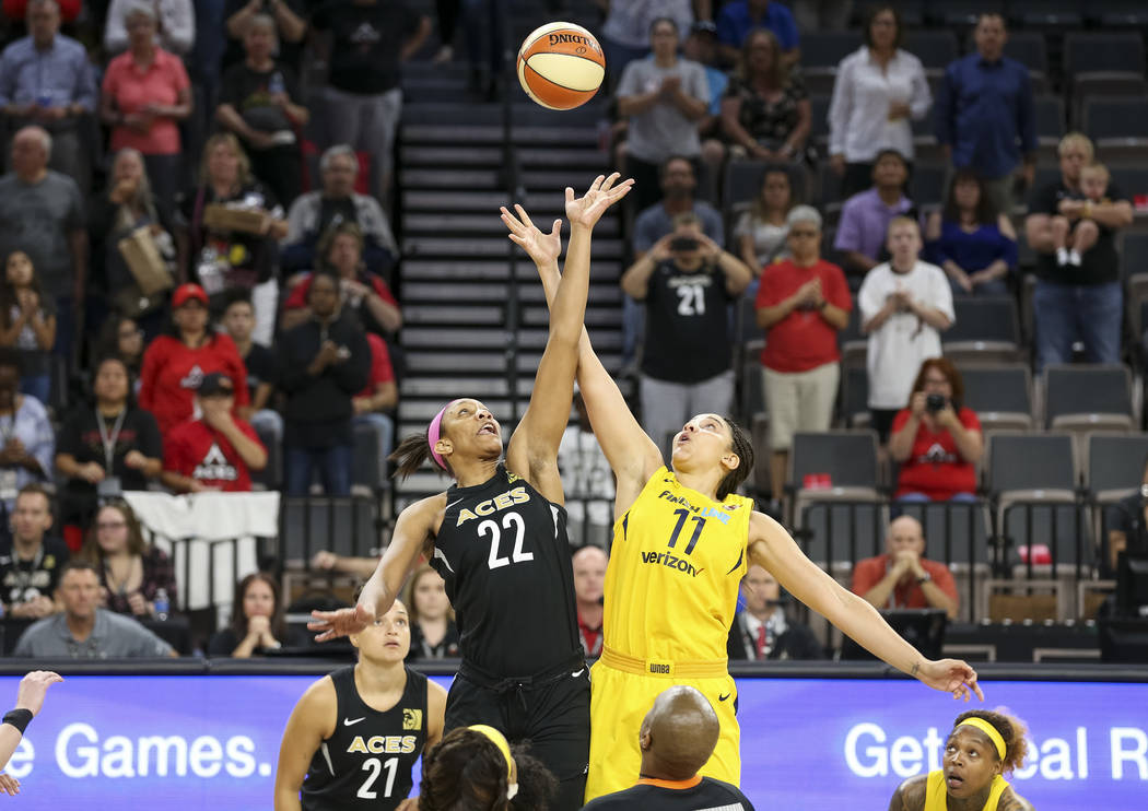 Las Vegas Aces center A'ja Wilson (22) and Indiana Fever forward Natalie Achonwa (11) tip off at the start of a WNBA basketball game at the Mandalay Bay Events Center on Saturday, Aug. 11, 2018. R ...