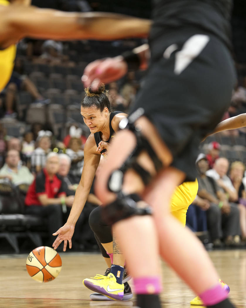 Las Vegas Aces guard Kayla McBride (21) drives the ball against the Indiana Fever during the first half of a WNBA basketball game at the Mandalay Bay Events Center on Saturday, Aug. 11, 2018. Rich ...