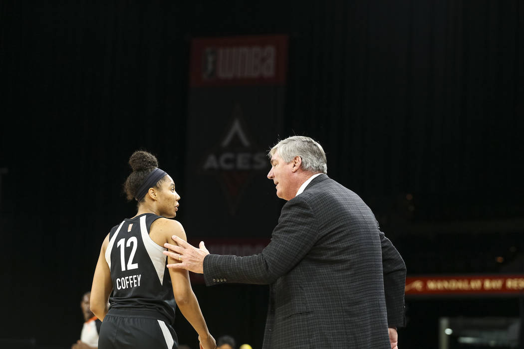 Las Vegas Aces coach Bill Laimbeer talks to Aces forward Nia Coffey (12) during the first half of a WNBA basketball game against the Indiana Fever at the Mandalay Bay Events Center on Saturday, Au ...