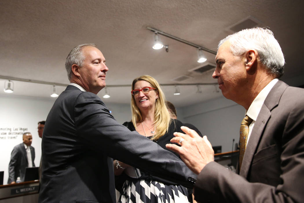 Steve Hill, left, who was named the new CEO of the Las Vegas Convention and Visitors Authority to replace retiring Rossi Ralenkotter, not pictured, shakes hands with Terry Miller of Cordell Corp., ...