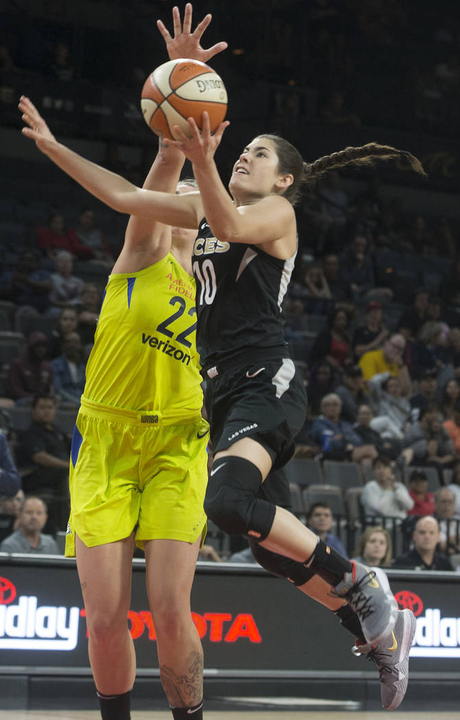 Aces guard Kelsey Plum (10) drives past Dallas Wings center Cayla George (22) in the 3rd quarter on Wednesday, June 27, 2018, at the Mandalay Bay Events Center, in Las Vegas. Benjamin Hager Las V ...