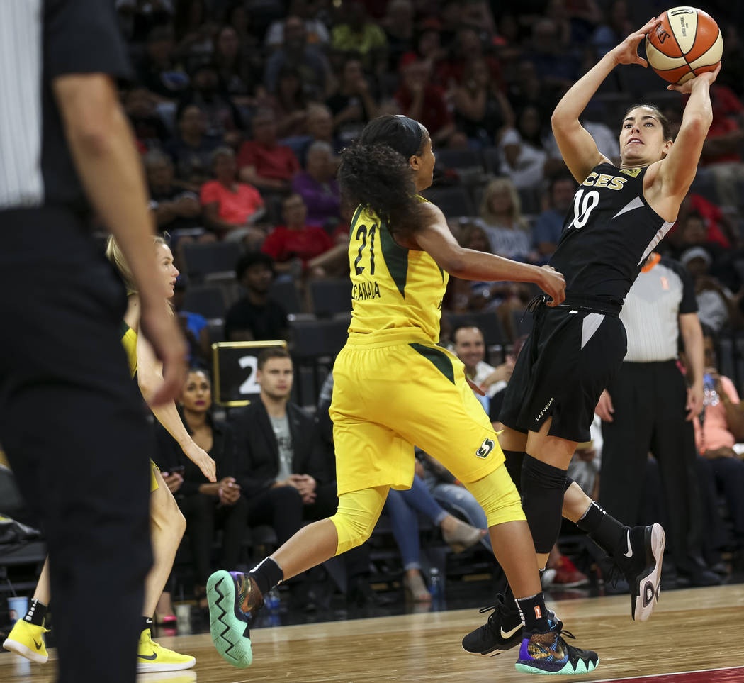 Las Vegas Aces guard Kelsey Plum (10) shoots over Seattle Storm guard Jordin Canada (21) in the second half of a WNBA basketball game at the Mandalay Bay Events Center in Las Vegas on Sunday, May ...
