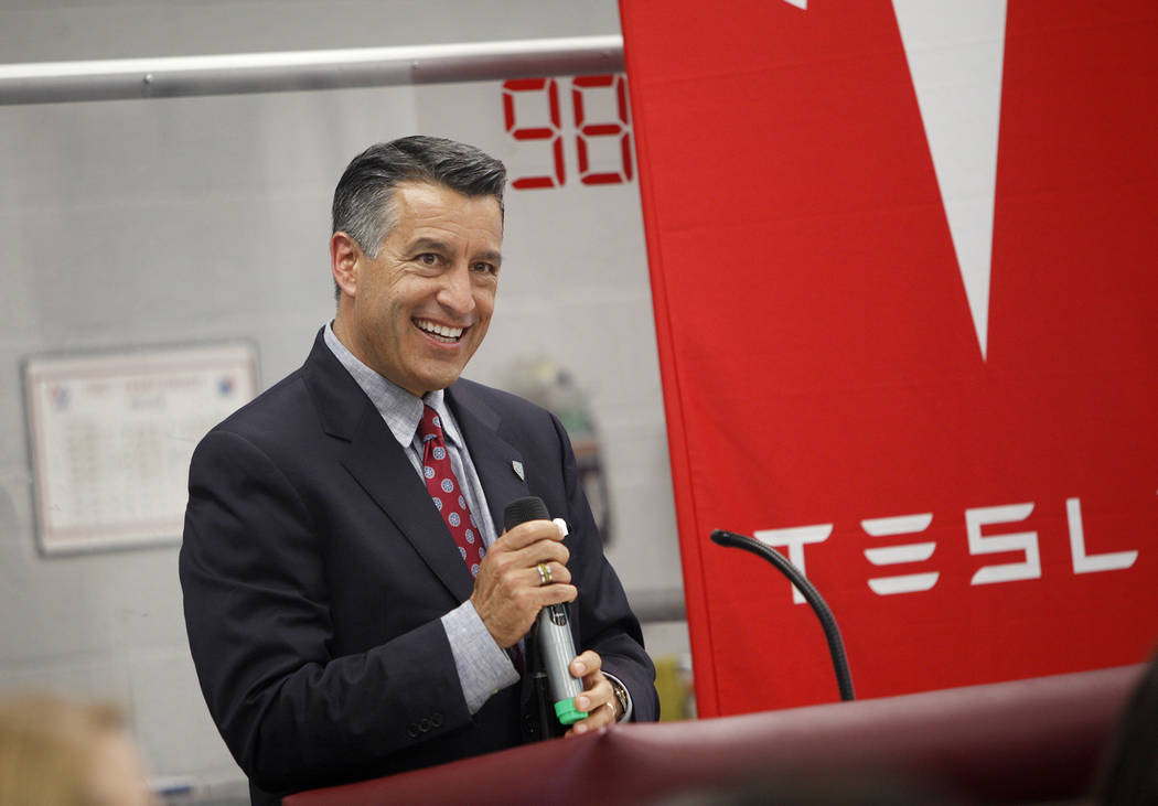 Gov. Brian Sandoval speaks at an event where Tesla and education leaders revealed new opportunities for robotics for education throughout the state at Cimarron-Memorial High School in Las Vegas, M ...