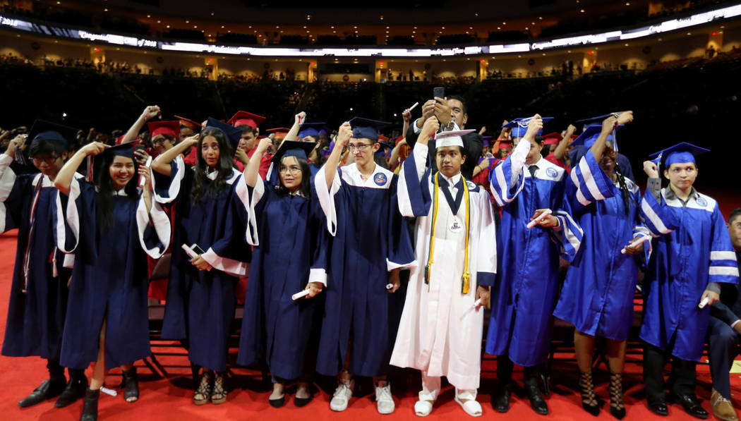 Students turn their tassels during Clark County School District summer graduation ceremony on Tuesday, Aug. 7, 2018, at Orleans Arena. For the past seven years, the district has hosted the event t ...
